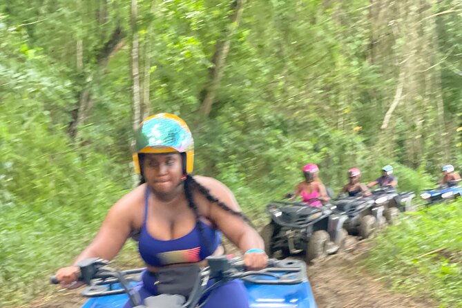 ATV and Bamboo Rafting with Transport from Montego Bay - Riding an ATV through a jungle-like setting