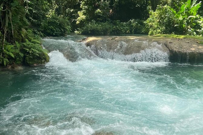Blue Hole, Secret Falls & River Rapids Tubing from Montego Bay - Blue Hole brings rope swings and clear fresh water