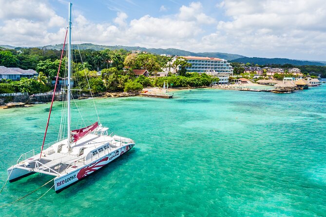 Lovers Rock Catamaran Cruise From Ocho Rios - Following Jamaica’s north shore toward sunset