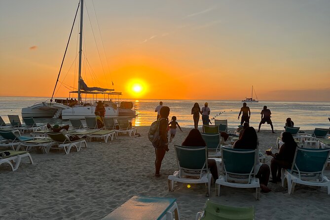 Negril Private Day Tour: ATV Ride, Party Catamaran & Ricks Cafe - Seven Mile Beach and the start of the catamaran