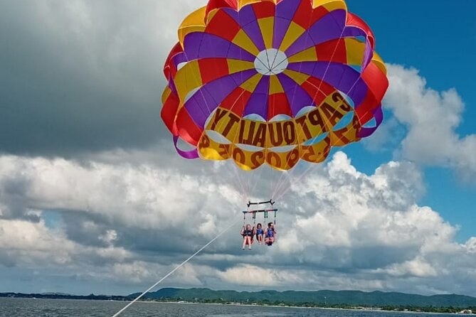 Negrils Seven Miles Beach, Rick's cafe and Parasailing Tour. - Lucea adds a short local stop