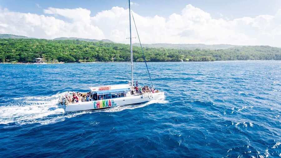 Ocho Rios: Catamaran Sail & Snorkel + Dunn's River Climb - Sailing out for the 45-minute snorkel stop