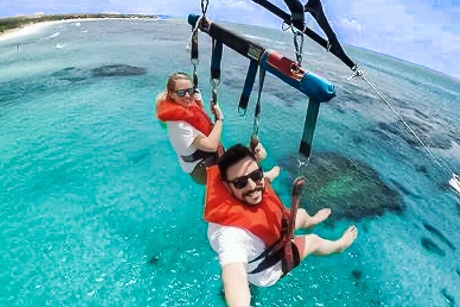 Parasailing above Turquoise Ocean Waters in Montego Bay - Taking off above Montego Bay