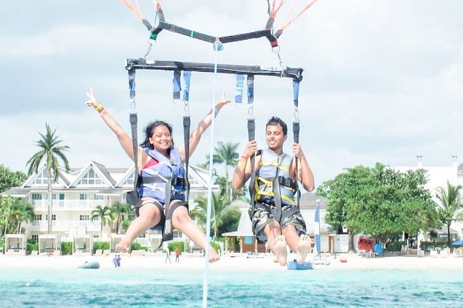 Parasailing, Blue Hole Mineral Spring, Seven Mile Beach - Who will enjoy this day most?