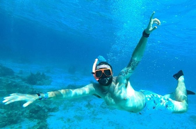 Party Catamaran Cruise with Open Bar and Snorkeling Montego Bay - Montego Bay views and the Margaritaville connection