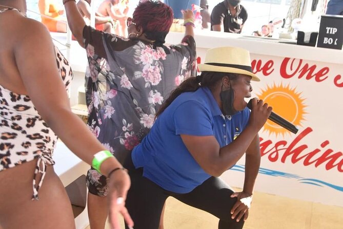 Party Catamaran: OpenBar, Music, Negril Beach, Caves, Snorkeling - Boarding the catamaran means getting wet