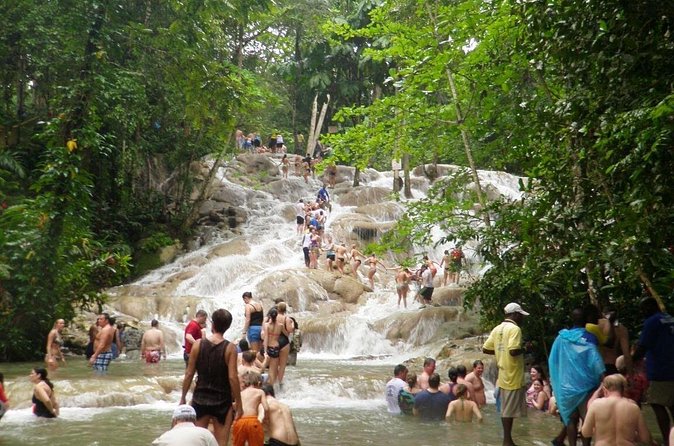 [PRIVATE]Dunn's River & Martha Brae Rafting - Entrance & Lunch - Dunn’s River Falls, a climb through moving water