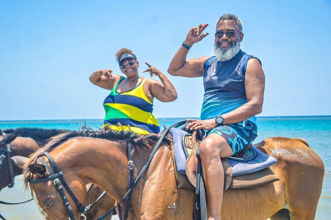 Private Tour to Dunns River and Horseback Riding with Local Guide - Climbing Dunns River Falls, one wet step at a time