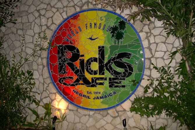 Private Trip to Blue Hole Mineral Springs, Negril & Ricks Café - Rick’s Café at sunset