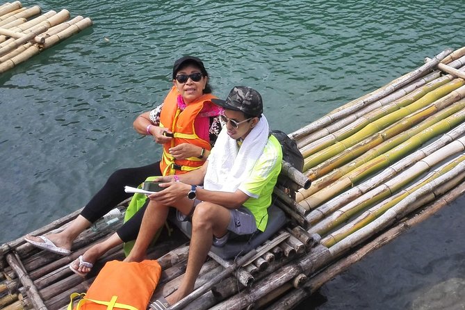 Rio Grande Bamboo Rafting Tour from Port Antonio - Boarding a bamboo raft for two
