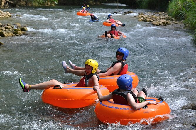 River Rapids Waterfalls Tubing and Beach Adventure with Transport - Bamboo shade, a rope swing, and the possible waterfall stop