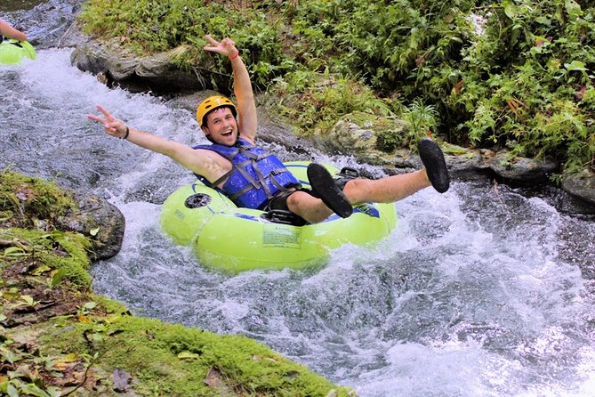 River Tubing with Private Transportation from Montego Bay - Bamboo shade, a riverbed break, and the rope swing