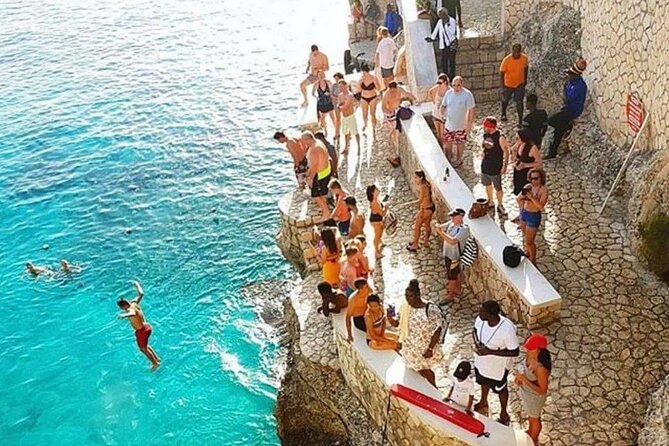 SUNSET PARTY CRUISE Rick's Cafe Ocean Coral / Eden Bay Guests - Boarding a large catamaran with music and drinks